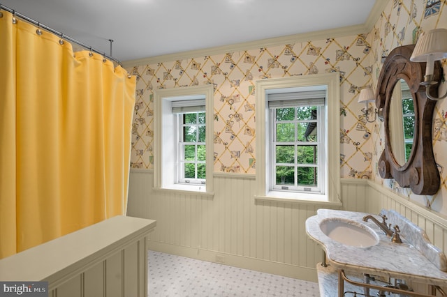 601 Maplewood Rd, Wayne, PA 19087 - full bathroom featuring wainscoting, healthy amount of natural light, ornamental molding, wallpapered walls, and vanity