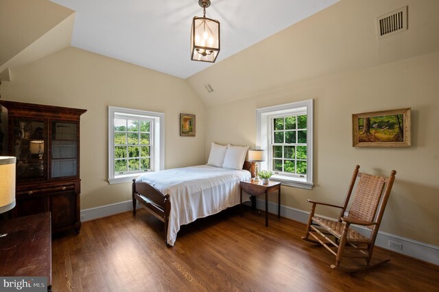 601 Maplewood Rd, Wayne, PA 19087 - bedroom with multiple windows, vaulted ceiling, wood finished floors, baseboards, and a chandelier
