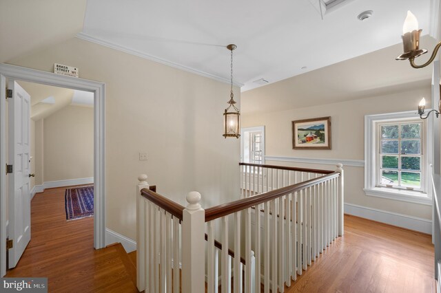 601 Maplewood Rd, Wayne, PA 19087 - hall with an upstairs landing, a chandelier, light wood-type flooring, baseboards, and crown molding