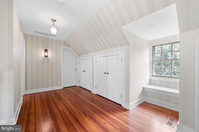 601 Maplewood Rd, Wayne, PA 19087 - bonus room featuring wood-type flooring, lofted ceiling, baseboards, and wallpapered walls