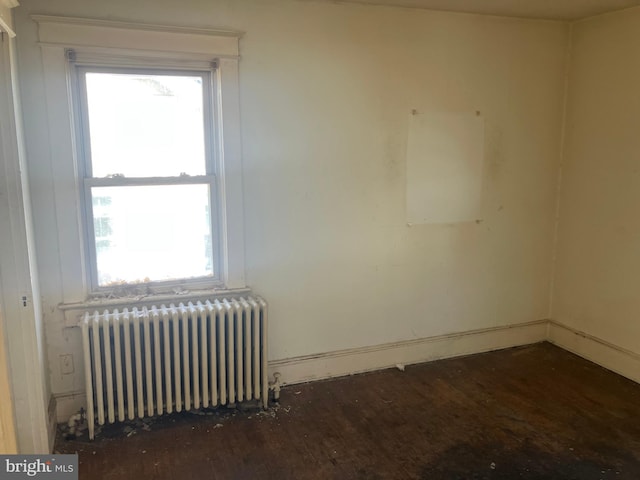 3505 24th St NE, Washington, DC 20018 - unfurnished room with radiator, wood finished floors, and baseboards