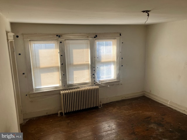 3505 24th St NE, Washington, DC 20018 - unfurnished room with radiator, hardwood / wood-style floors, and baseboards