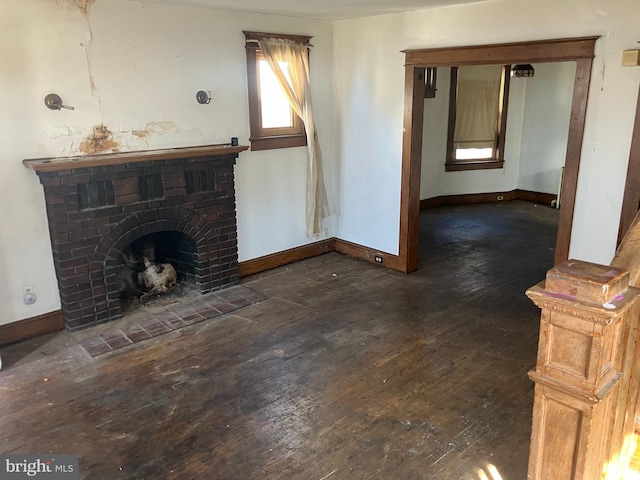 3505 24th St NE, Washington, DC 20018 - unfurnished living room with hardwood / wood-style floors, baseboards, and a brick fireplace