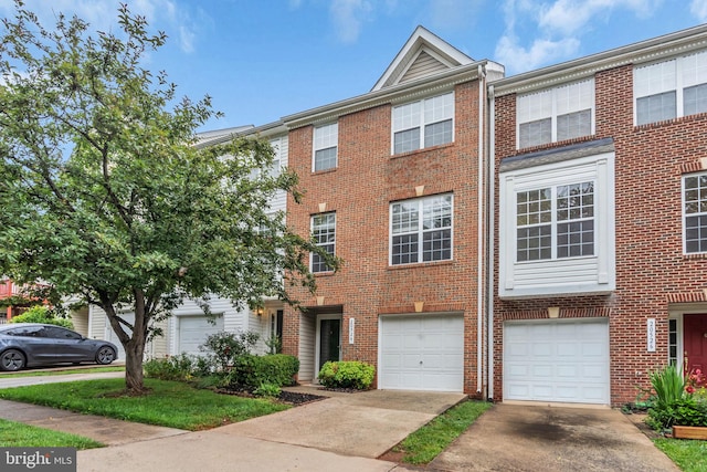 20524 Blue Heron Ter, Sterling, VA 20165 - view of property featuring driveway, brick siding, and an attached garage