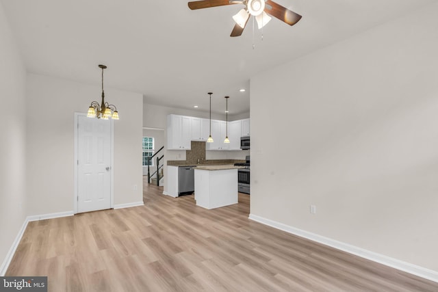 20524 Blue Heron Ter, Sterling, VA 20165 - kitchen with stainless steel appliances, white cabinetry, recessed lighting, ceiling fan, and light wood finished floors