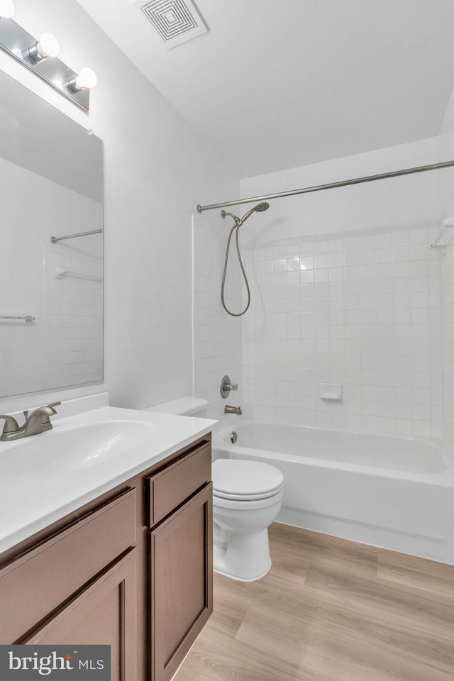 20524 Blue Heron Ter, Sterling, VA 20165 - bathroom featuring wood finished floors, vanity, and shower / tub combination