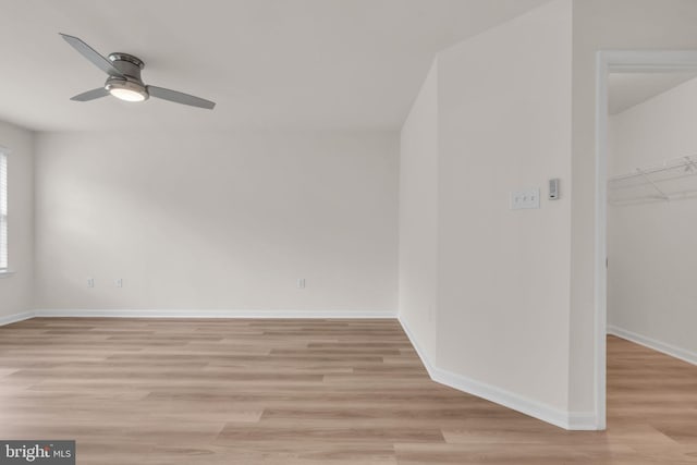 20524 Blue Heron Ter, Sterling, VA 20165 - unfurnished bedroom featuring light wood finished floors, a closet, a spacious closet, and ceiling fan