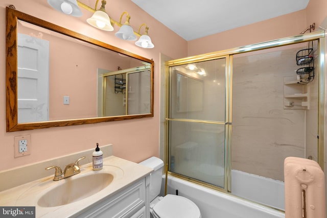 546 W University Pkwy, Baltimore, MD 21210 - full bath with vanity, toilet, and shower / bath combination with glass door