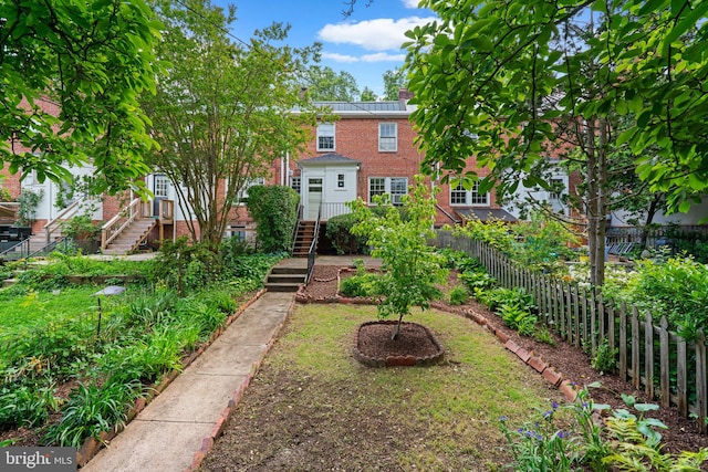 546 W University Pkwy, Baltimore, MD 21210 - view of front of house featuring brick siding, a chimney, and stairway