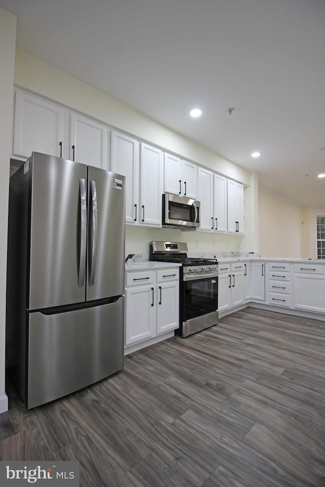 3655 Islington St, Frederick, MD 21704 - kitchen with appliances with stainless steel finishes, white cabinets, recessed lighting, dark wood-style flooring, and light countertops