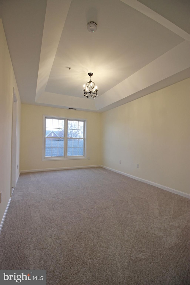 3655 Islington St, Frederick, MD 21704 - unfurnished room with a raised ceiling, carpet, baseboards, a chandelier, and a smoke detector