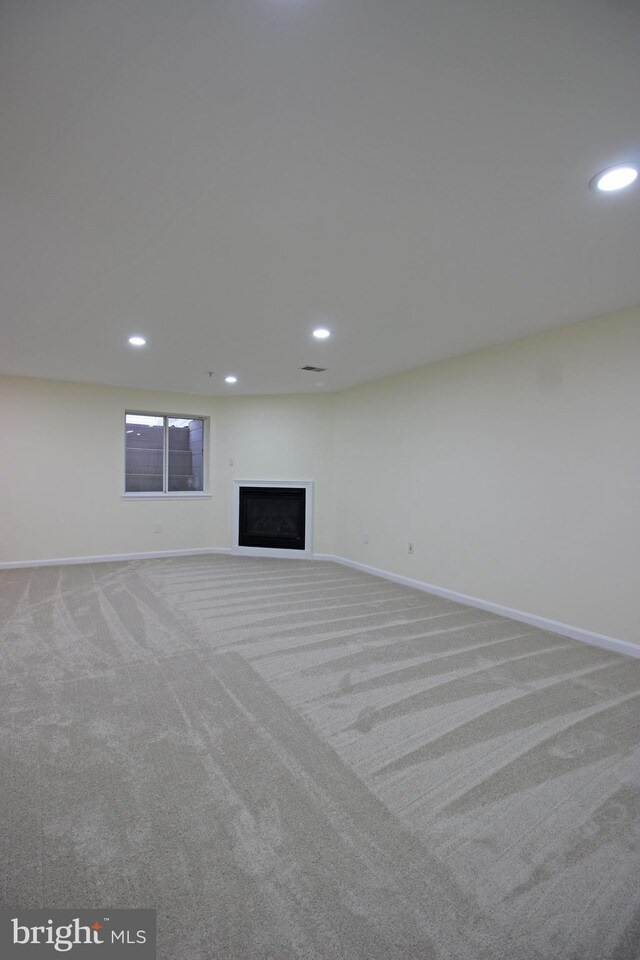 3655 Islington St, Frederick, MD 21704 - unfurnished living room featuring carpet flooring, baseboards, recessed lighting, and a fireplace