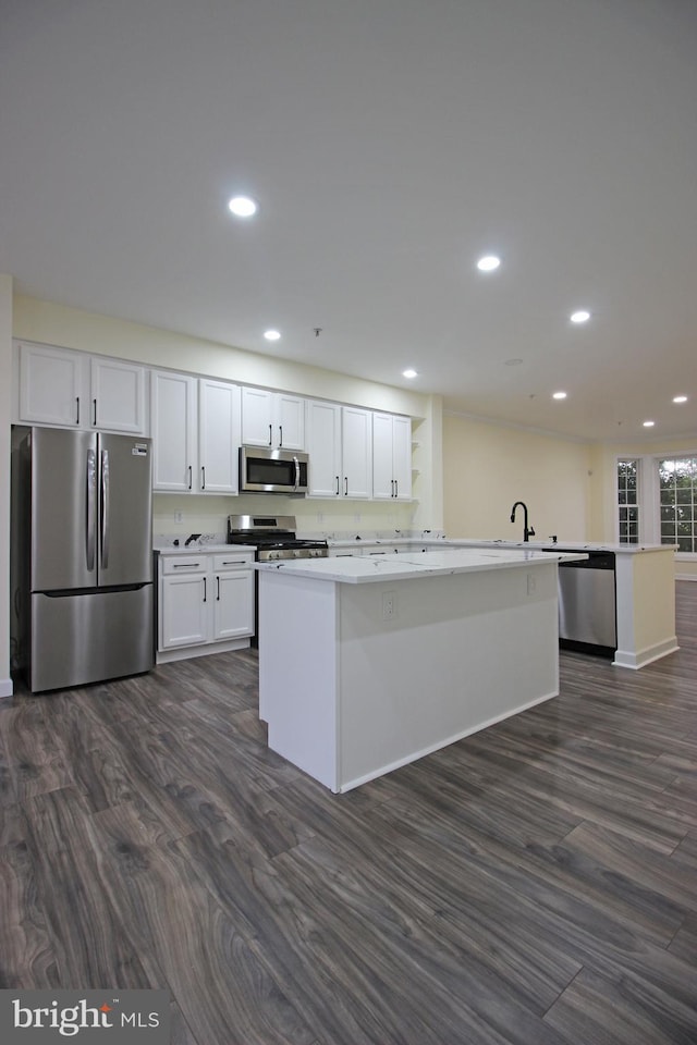 3655 Islington St, Frederick, MD 21704 - kitchen featuring appliances with stainless steel finishes, dark wood-style floors, white cabinets, recessed lighting, and a center island