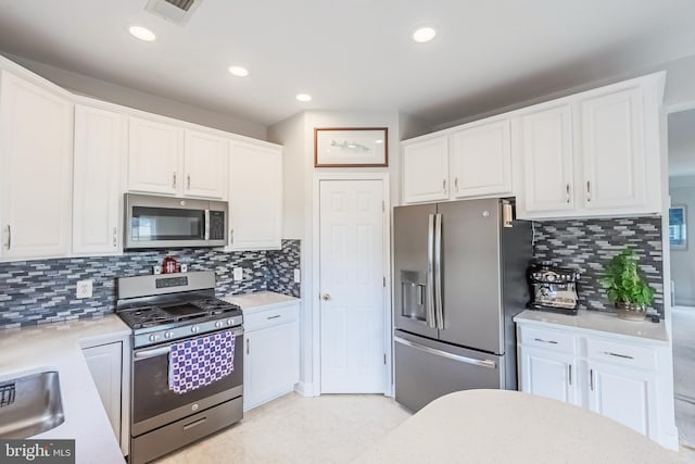 222 Hawks View Sq SE, Leesburg, VA 20175 - kitchen featuring stainless steel appliances, white cabinets, light countertops, decorative backsplash, and recessed lighting