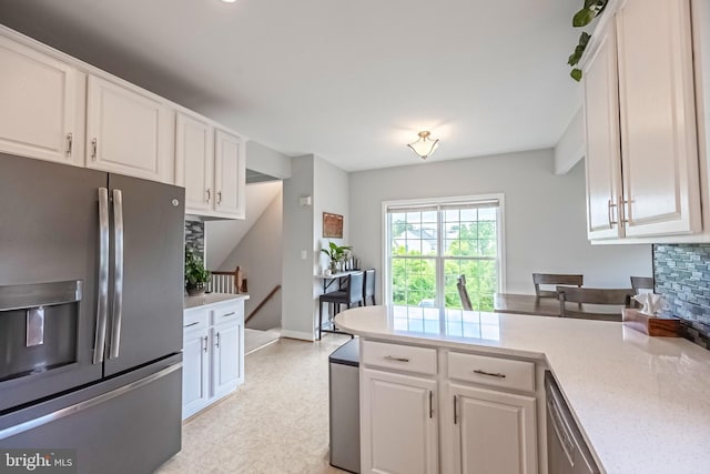 222 Hawks View Sq SE, Leesburg, VA 20175 - kitchen with appliances with stainless steel finishes, white cabinets, a peninsula, and light flooring