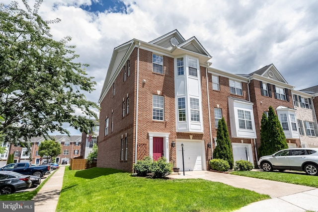 222 Hawks View Sq SE, Leesburg, VA 20175 - view of property with an attached garage, brick siding, a front lawn, and concrete driveway
