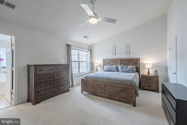 222 Hawks View Sq SE, Leesburg, VA 20175 - bedroom with vaulted ceiling, light colored carpet, ensuite bath, a ceiling fan, and baseboards