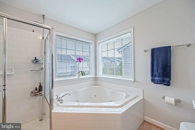 222 Hawks View Sq SE, Leesburg, VA 20175 - bathroom with a jetted tub, a shower stall, tile patterned flooring, and baseboards