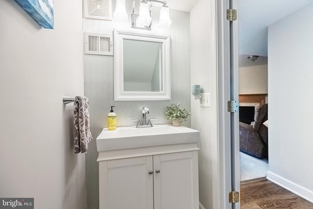 222 Hawks View Sq SE, Leesburg, VA 20175 - bathroom featuring vanity, wood finished floors, and baseboards