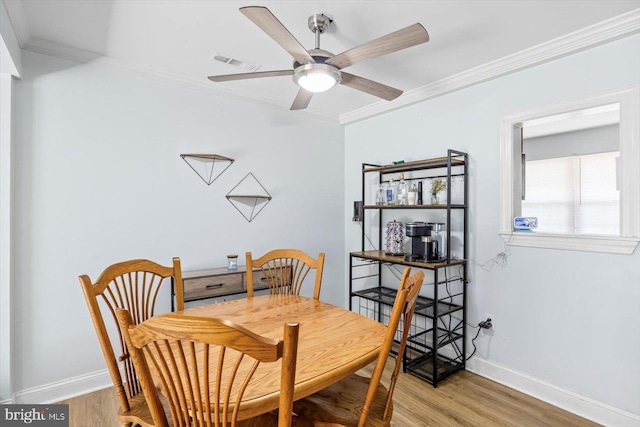 1931 Fort Monroe Ct, Dumfries, VA 22026 - dining space with crown molding, light wood-type flooring, and a ceiling fan