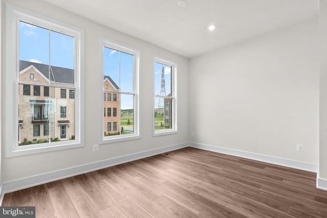 23062 Soaring Heights Ter, Ashburn, VA 20148 - spare room with wood finished floors and baseboards