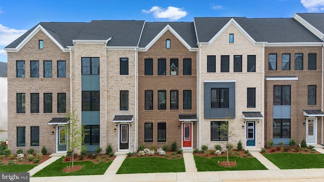 23062 Soaring Heights Ter, Ashburn, VA 20148 - view of property featuring brick siding and a front yard