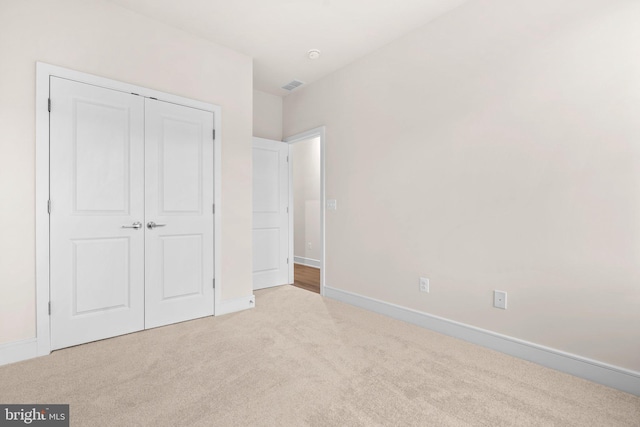 23062 Soaring Heights Ter, Ashburn, VA 20148 - unfurnished bedroom with carpet, baseboards, and a closet