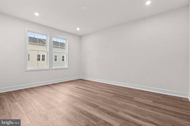 23062 Soaring Heights Ter, Ashburn, VA 20148 - empty room featuring wood finished floors, baseboards, and recessed lighting