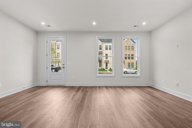 23062 Soaring Heights Ter, Ashburn, VA 20148 - empty room with wood finished floors, baseboards, and recessed lighting