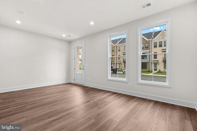 23062 Soaring Heights Ter, Ashburn, VA 20148 - empty room featuring wood finished floors, baseboards, and recessed lighting