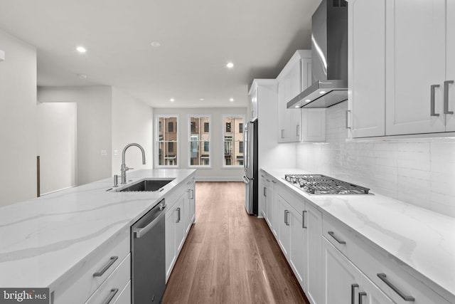 23062 Soaring Heights Ter, Ashburn, VA 20148 - kitchen featuring wall chimney exhaust hood, stainless steel appliances, a sink, recessed lighting, and wood finished floors