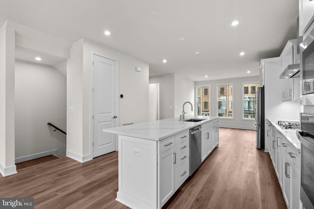 23062 Soaring Heights Ter, Ashburn, VA 20148 - kitchen featuring a sink, appliances with stainless steel finishes, an island with sink, white cabinets, and wood finished floors