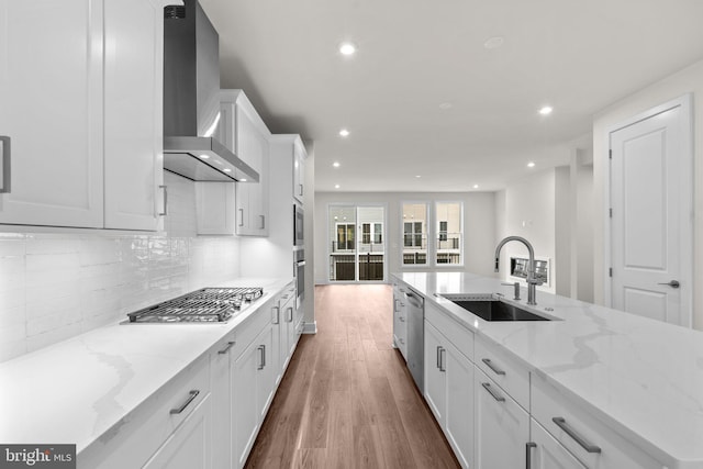 23062 Soaring Heights Ter, Ashburn, VA 20148 - kitchen with a sink, wall chimney range hood, appliances with stainless steel finishes, recessed lighting, and wood finished floors