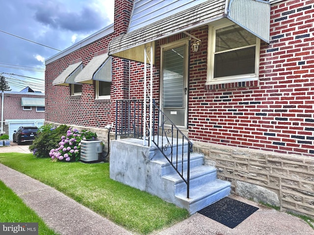 8128 Lister St, Philadelphia, PA 19152 - property entrance featuring brick siding and central AC unit