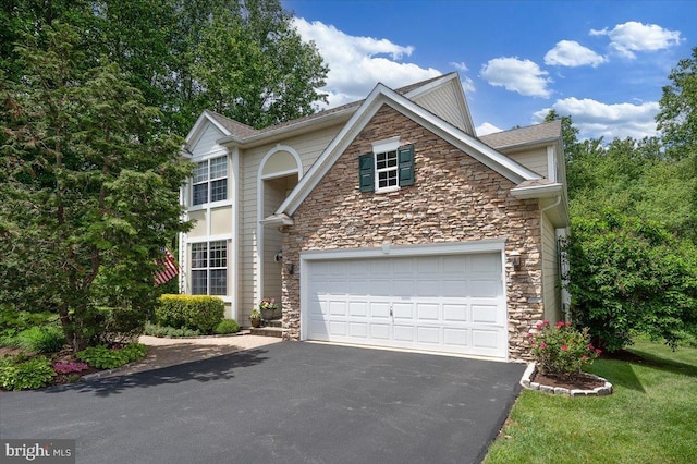 111 Brookline Ct, Avondale, PA 19311 - traditional-style house with stone siding, asphalt driveway, and a front lawn