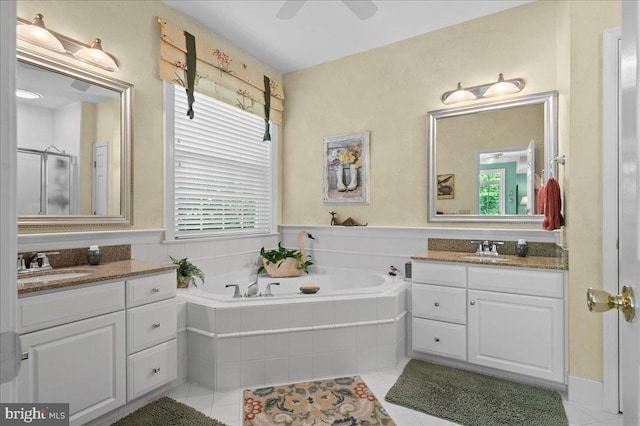 111 Brookline Ct, Avondale, PA 19311 - full bath featuring tile patterned flooring, two vanities, a garden tub, a ceiling fan, and a shower stall