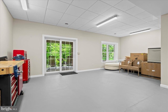 111 Brookline Ct, Avondale, PA 19311 - sitting room featuring a paneled ceiling, baseboards, and concrete floors