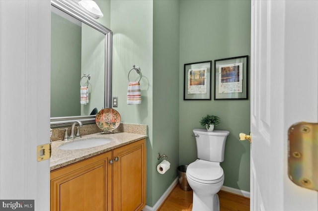 111 Brookline Ct, Avondale, PA 19311 - half bath with vanity, toilet, wood finished floors, and baseboards