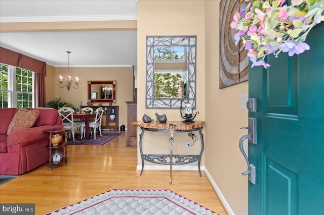 111 Brookline Ct, Avondale, PA 19311 - foyer with light wood-style floors, a chandelier, ornamental molding, and baseboards