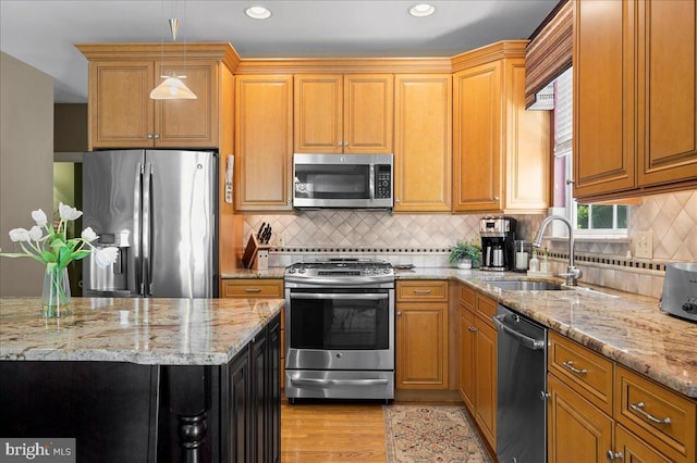 111 Brookline Ct, Avondale, PA 19311 - kitchen with stainless steel appliances, a sink, light stone counters, light wood-type flooring, and recessed lighting