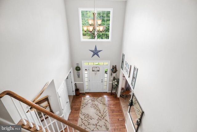 550 Long Meadow Dr, Fredericksburg, VA 22406 - foyer featuring a chandelier, a towering ceiling, stairs, and wood finished floors