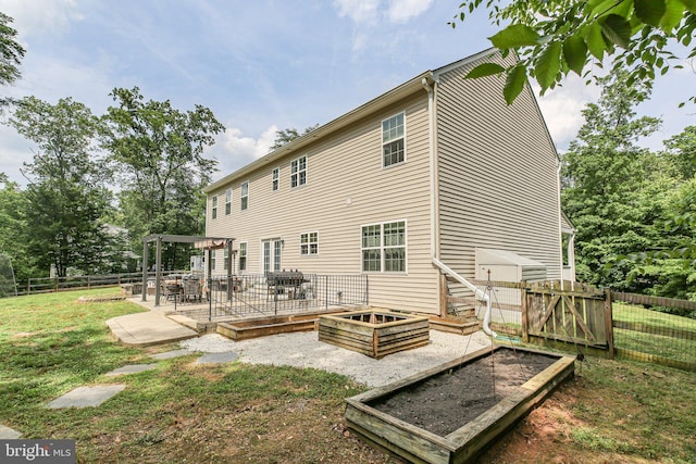 550 Long Meadow Dr, Fredericksburg, VA 22406 - rear view of property featuring a patio area, a fenced backyard, and a vegetable garden