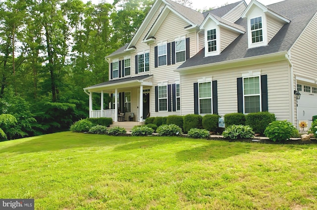 550 Long Meadow Dr, Fredericksburg, VA 22406 - colonial house featuring covered porch, a front yard, and a shingled roof