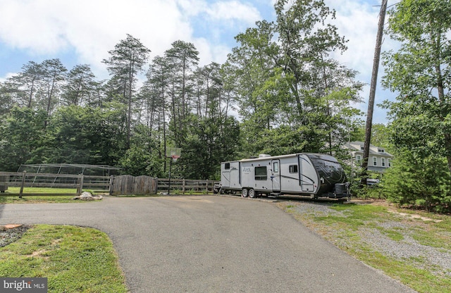 550 Long Meadow Dr, Fredericksburg, VA 22406 - view of front of house featuring driveway, view of wooded area, and a gate