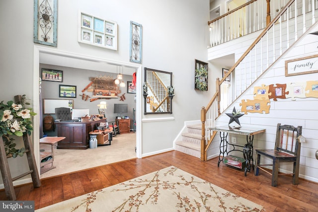 550 Long Meadow Dr, Fredericksburg, VA 22406 - entrance foyer with wood-type flooring, stairs, and a towering ceiling