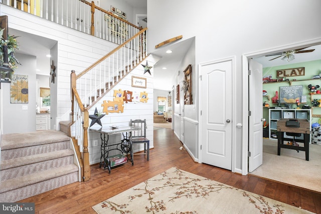 550 Long Meadow Dr, Fredericksburg, VA 22406 - entryway with stairway, a towering ceiling, a ceiling fan, and hardwood / wood-style floors