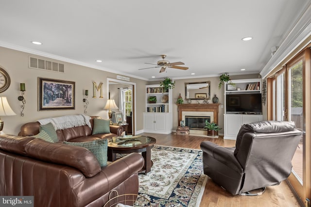 4 False Heather Way, Medford, NJ 08055 - living area featuring healthy amount of natural light, a ceiling fan, wood finished floors, recessed lighting, and a premium fireplace