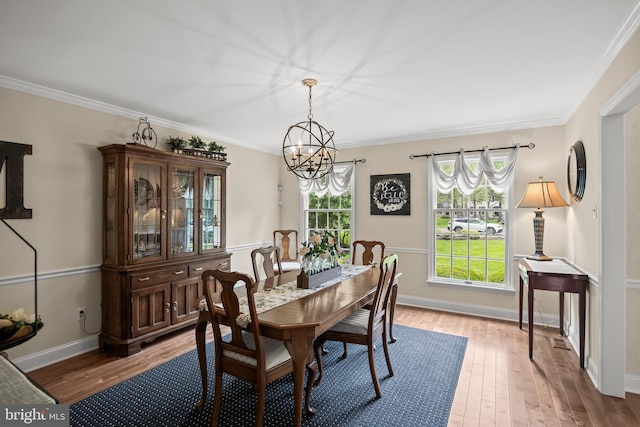 4 False Heather Way, Medford, NJ 08055 - dining area featuring a chandelier, wood finished floors, baseboards, and ornamental molding