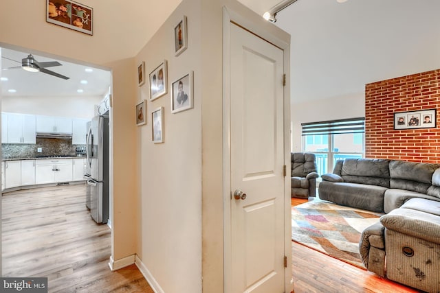 2409 Lightfoot Dr, Baltimore, MD 21209 - corridor featuring light wood-style flooring, baseboards, and recessed lighting