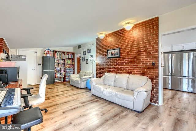 2409 Lightfoot Dr, Baltimore, MD 21209 - living room with brick wall and wood finished floors